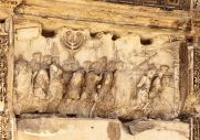 12147732-This-wall-relief-on-the-Arch-of-Titus-reveals-Roman-soldiers-carrying-spoils-from-the-destruction-of-Stock-Photo